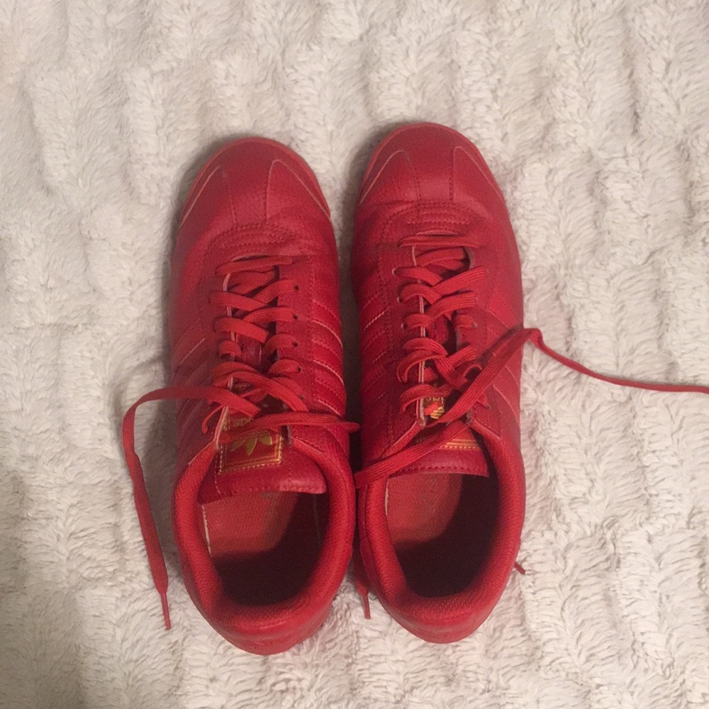 Men’s red adidas tennis shoes